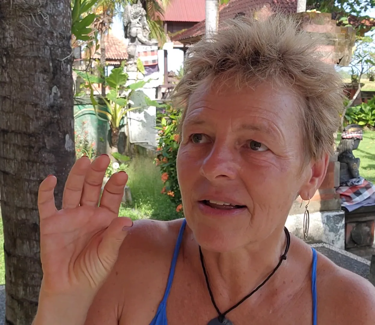 BeAta Fuller mid-sentence outdoors, one hand raised