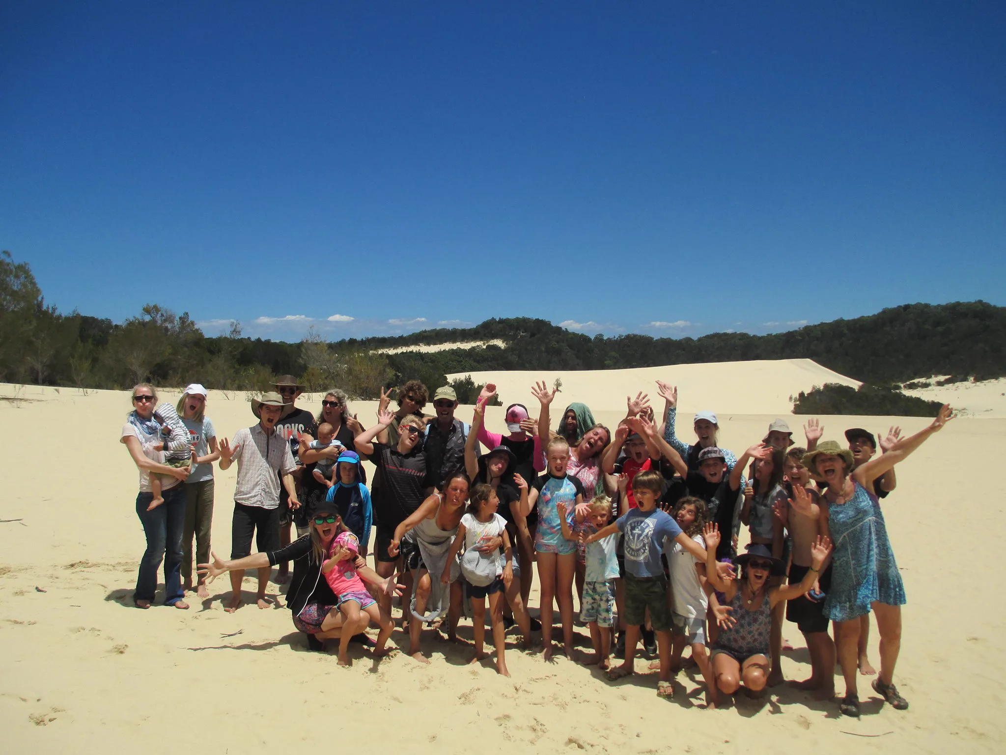 Group celebrating at the dunes