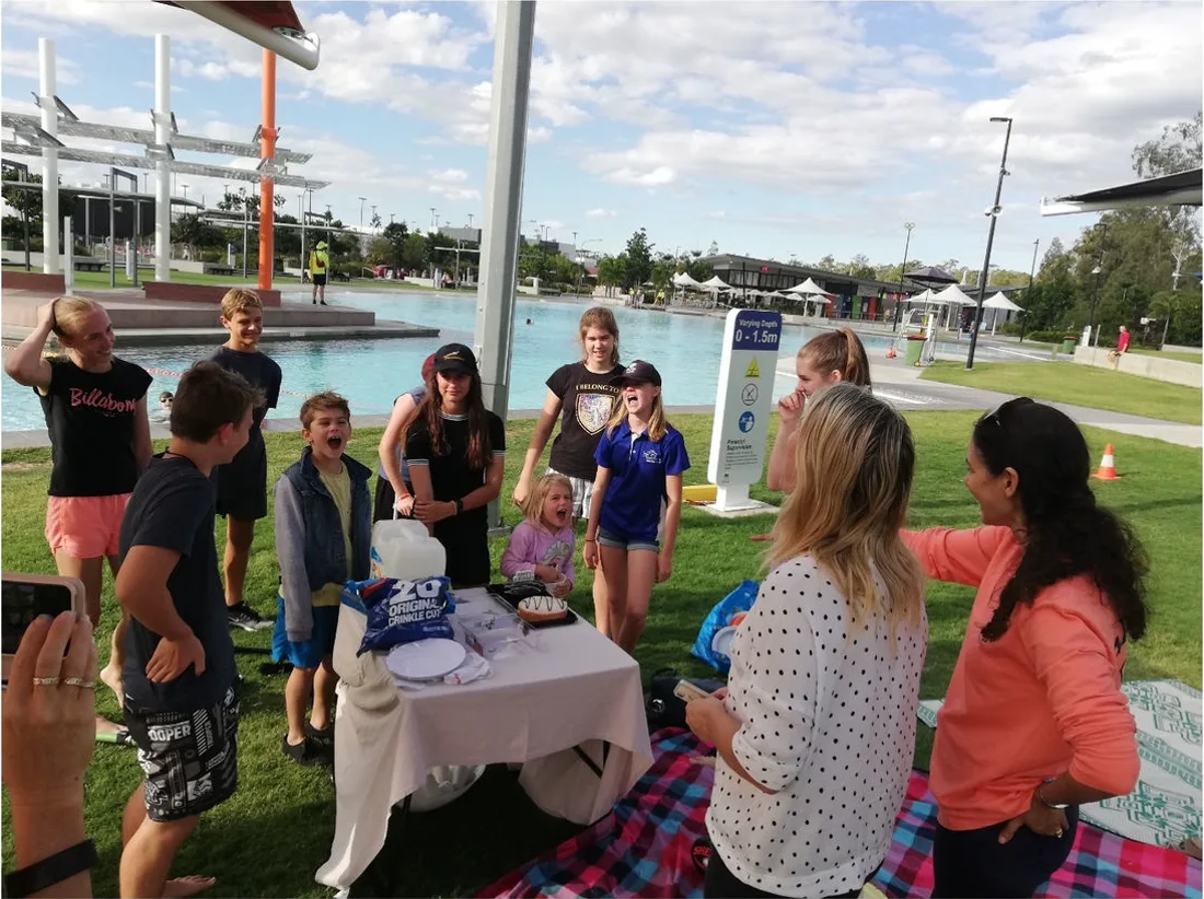 Parents and children gathered together outdoors