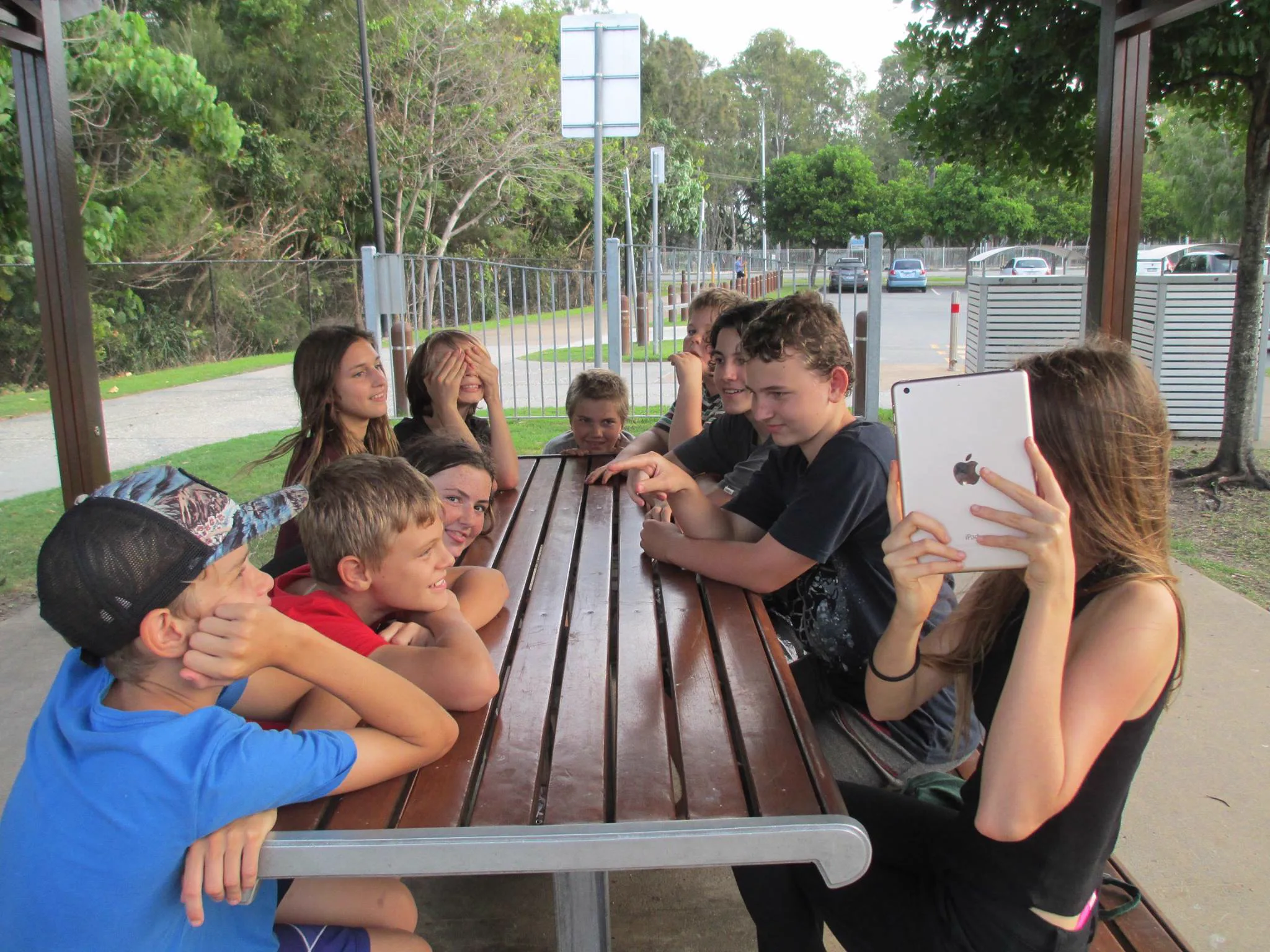 Teens gathered around a table
